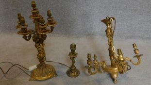 A Rococo style chandelier, a similar six branch table candelabra and a single similar table lamp.