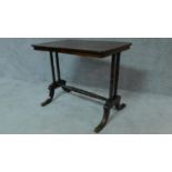 A Regency rosewood centre table on stretchered bobbin turned supports on swept feet terminating in