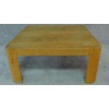 A contemporary oak low table. H.18 W.86 D.86cm