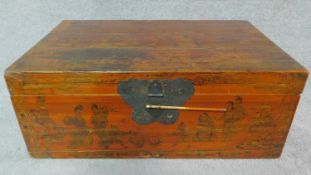 A painted Chinese wooden trunk with figural decoration. H.29 W.76 D.49cm