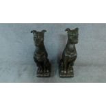 A pair of moulded figures of guard dogs. H.77cm