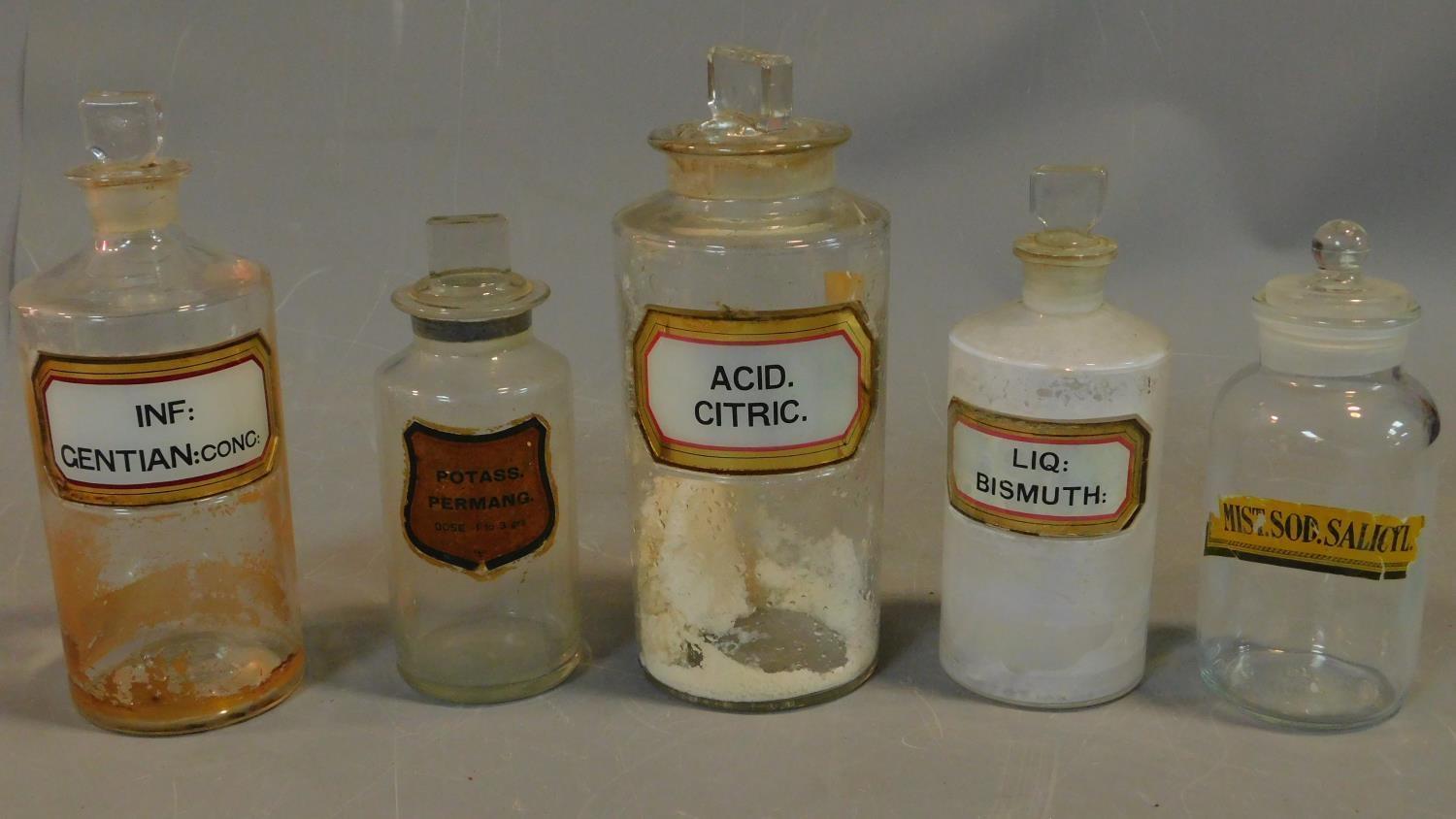 A collection of five various glass chemist's jars with ground glass stoppers. H.24cm (tallest)