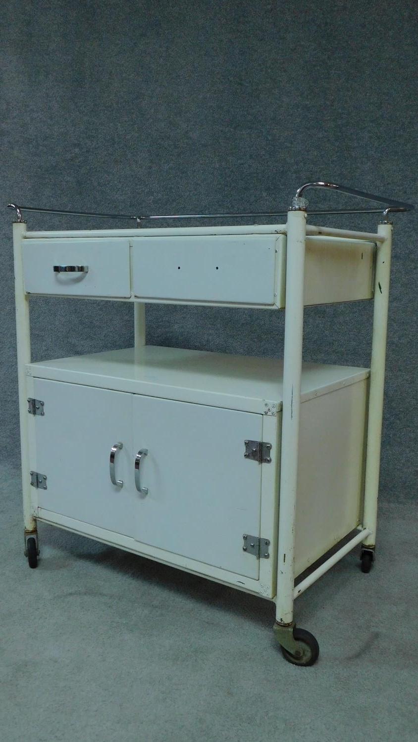 A white painted and metal medical cabinet/trolley with drawers and cupboards on casters. H.90 W.86 - Image 2 of 6