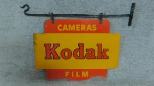 A vintage Kodak cameras hanging enamel sign. Double sided with original hanging fixtures. H.56cm W.