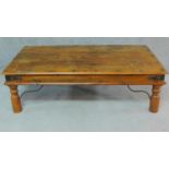 An Indian teak iron bound coffee table. H.41 W.136 D.76cm