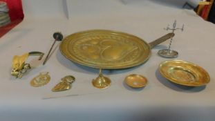 An embossed brass offertory tray and a collection of miscellaneous brass items. D.43cm.