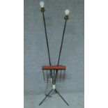 A vintage 1960's twin light metal lamp standard with ceramic table top and magazine rack to tripod