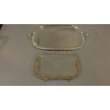 Two silver plated trays, one with glass base and pierced floral and bird design. W.65cm L.41cm