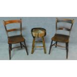 A pair of 19th century elm seated bar back dining chairs and a stool upholstered in animal skin. H.