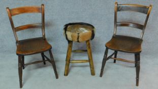 A pair of 19th century elm seated bar back dining chairs and a stool upholstered in animal skin. H.