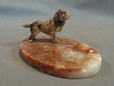 An Austrian cold painted spaniel and marble ashtray