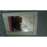 A large rectangular wall mirror with frame encrusted with many sea shells. H.112cm W.78cm