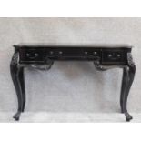 A French style ebonised console table fitted frieze drawers on cabriole supports. H.77 W.118 D.75cm