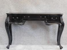 A French style ebonised console table fitted frieze drawers on cabriole supports. H.77 W.118 D.75cm