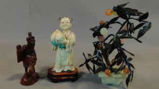Two Chinese figures and a miniature tree in a jade pot. H.25cm (tallest)