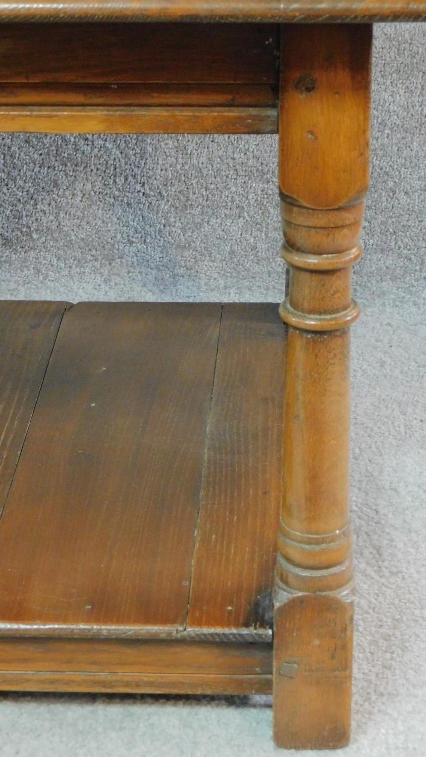 A pair of antique style country oak side tables on turned supports united by undertier. H.50 W.61 - Image 5 of 5