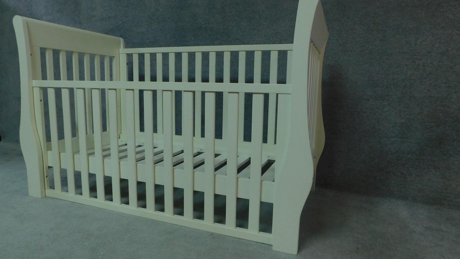 A contemporary white painted child's cot. H.98cm W.140cm D.67cm - Image 2 of 2