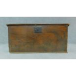An antique elm coffer with hinged top and iron lock. H.36cm W.66cm D.36cm