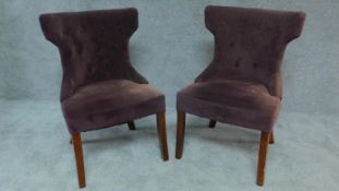 A pair of buttoned upholstered unicorn style tub side chairs. H.89cm