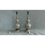 A pair of metal lamp stands of double gourd form. H.61cm