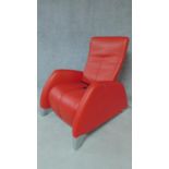 A De Sede red leather reclining armchair with motor action. H.100 W.76cm