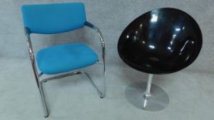 A Vitra chrome framed armchair and a smoked charcoal moulded tub swivel chair by Kartell, stamped to