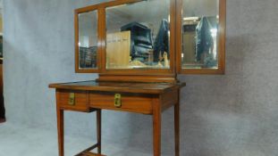 A late 19th century mahogany French dressing table with black painted top and triple folding