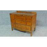 A vintage 1950's oak chest of three long drawers H.79 W.90 D.45cm