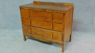 A vintage 1950's oak chest of three long drawers H.79 W.90 D.45cm