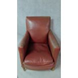 A vintage beech framed tub armchair in faux leather. H.96cm
