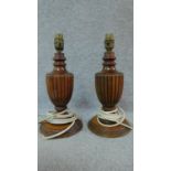 A pair of turned and reeded table lamps of urn form. H.33cm