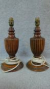 A pair of turned and reeded table lamps of urn form. H.33cm