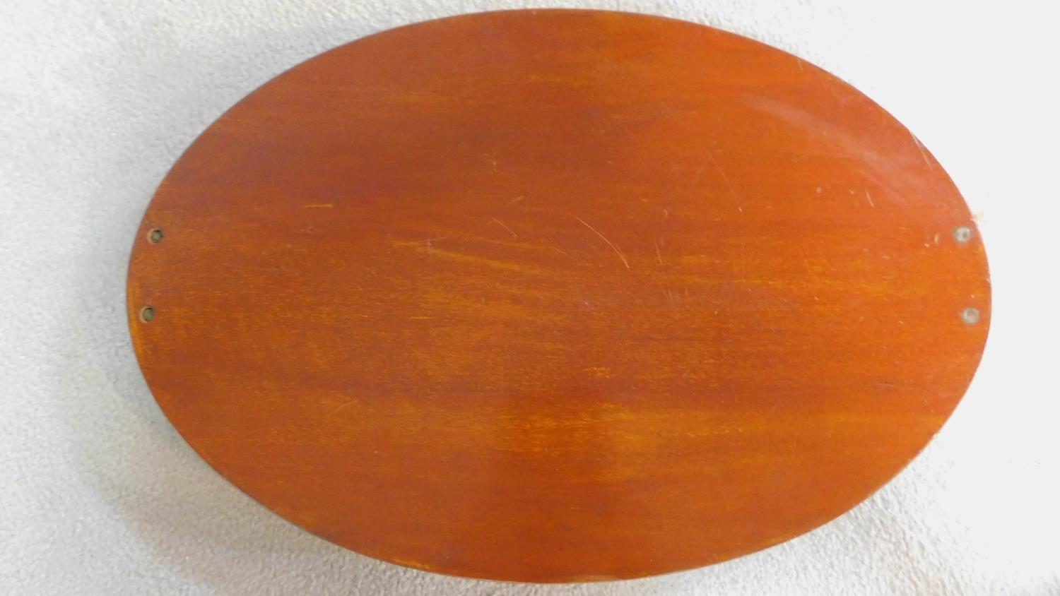 An Edwardian mahogany oval tray with satinwood conch shell inlay and crossbanding with twin brass - Image 5 of 7