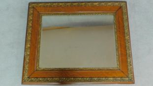 A late 19th century oak and gilt gesso framed rectangular wall mirror fitted original bevelled