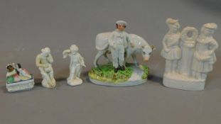 A collection of five early porcelain and earthenware figures, including a man with a bill, a