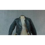 A vintage leather motorcycle jacket. (small size).