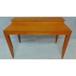 A teak Heal's writing desk with fitted superstructure on square tapering supports. H.80 W.121 D.66cm