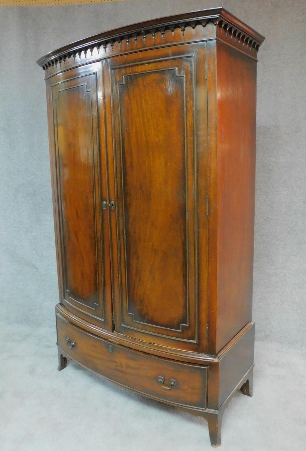 An early 20th century Georgian style mahogany bowfronted wardrobe fitted base drawer on swept - Image 7 of 10