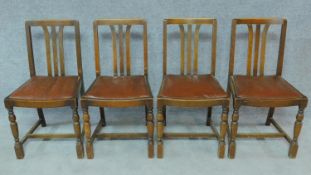 A set of four mid 20th century oak dining chairs. H.84cm