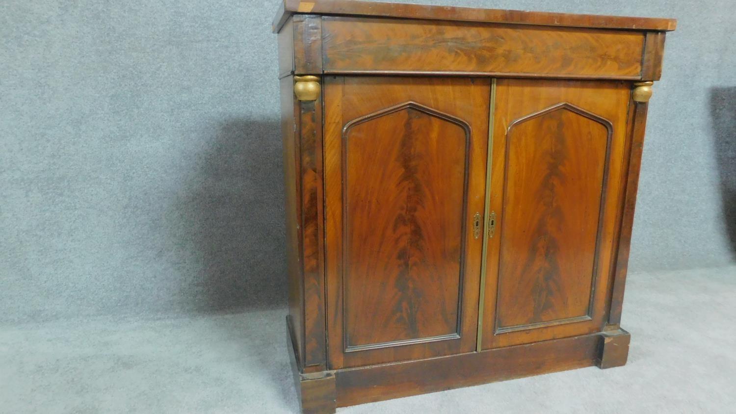 A Regency mahogany two door chiffonier with arched panel doors flanked by pilasters. H.92cm W.92cm - Image 2 of 4