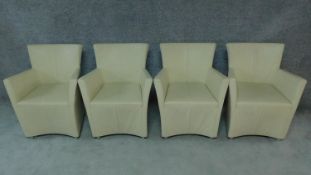 A set of four leather upholstered tub armchairs by Gijs Papavoine for Martis, Holland. H.87cm