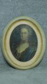 A 19th century oil on canvas laid on board, oval framed portrait. 59x48cm