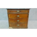 A 19th century Continental walnut commode with grey marble top, fitted four long drawers. H.74 W.