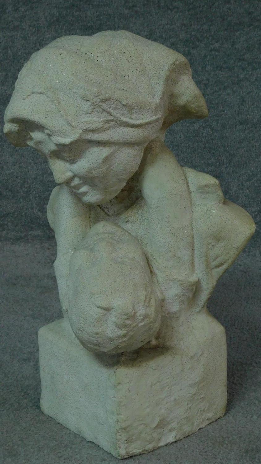 A stone bust of mother and child, the mother is looking down at her son who has his arms around - Image 2 of 5