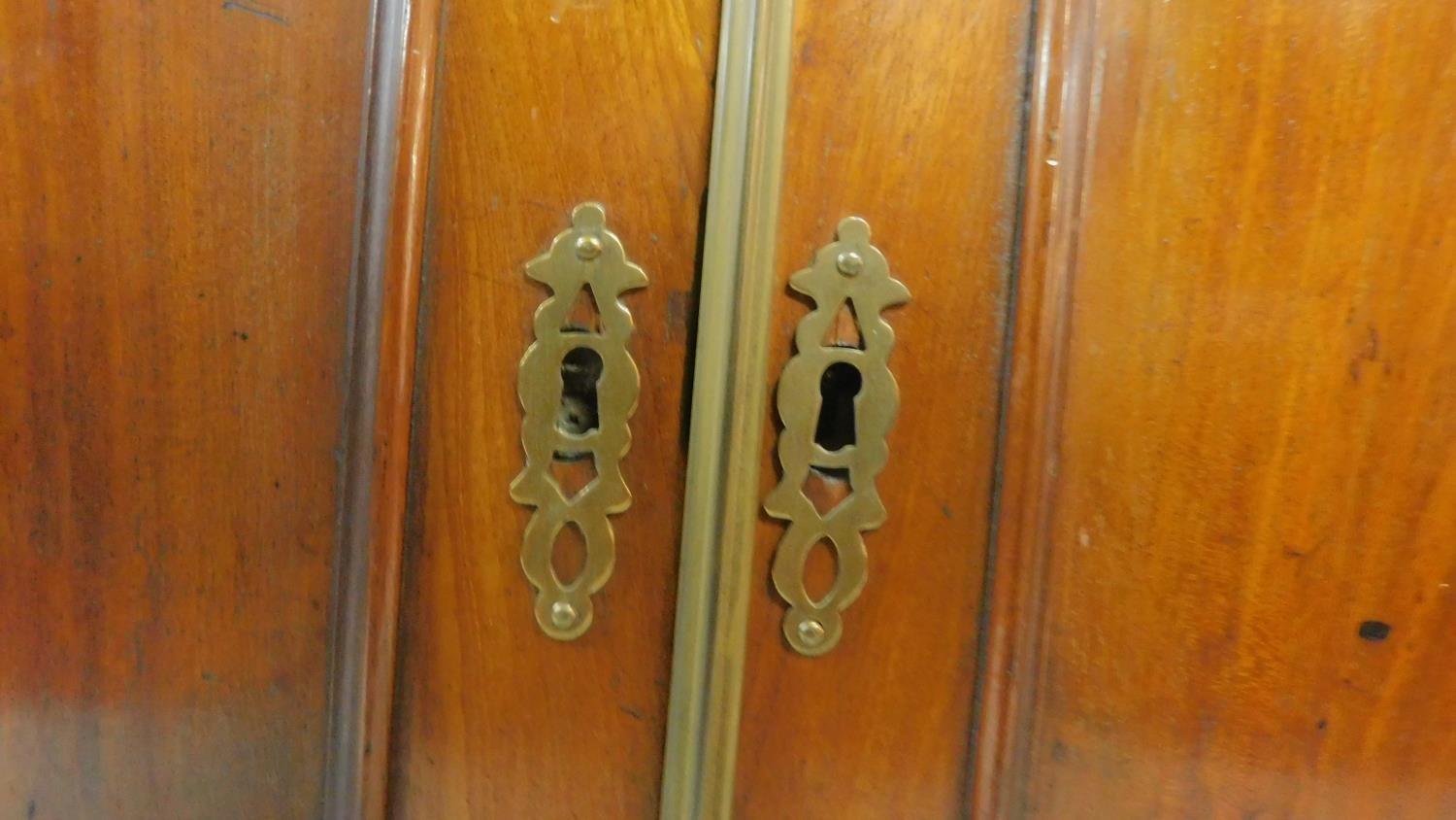 A Regency mahogany two door chiffonier with arched panel doors flanked by pilasters. H.92cm W.92cm - Image 4 of 4