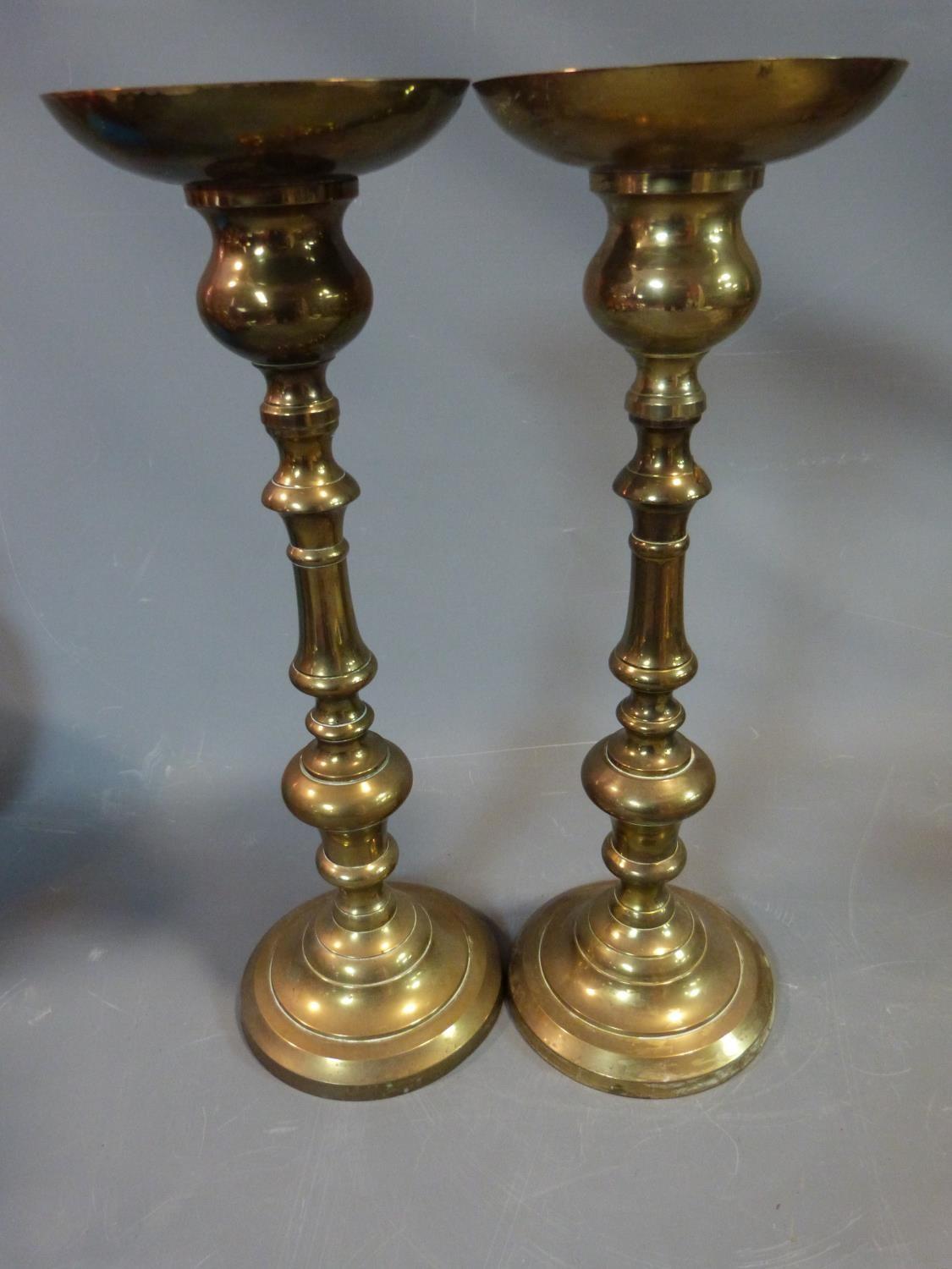 A pair of brass pricket candle sticks. H 50cm.