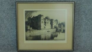 A signed etching by British engraver Stanley Anderson, building by a lake with boats. 51x45cm