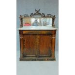 A Regency rosewood chiffonier with dolphin carved mirrored back and marble top above frieze drawer