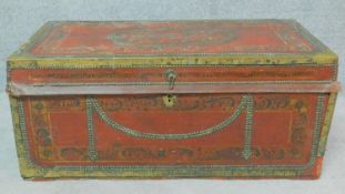 A 19th century brass bound and studded twin handled chest with allover painted decoration. H.40 W.90