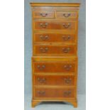 A Georgian style yew chest on chest with two short and six long drawers fitted brushing slide. H.174